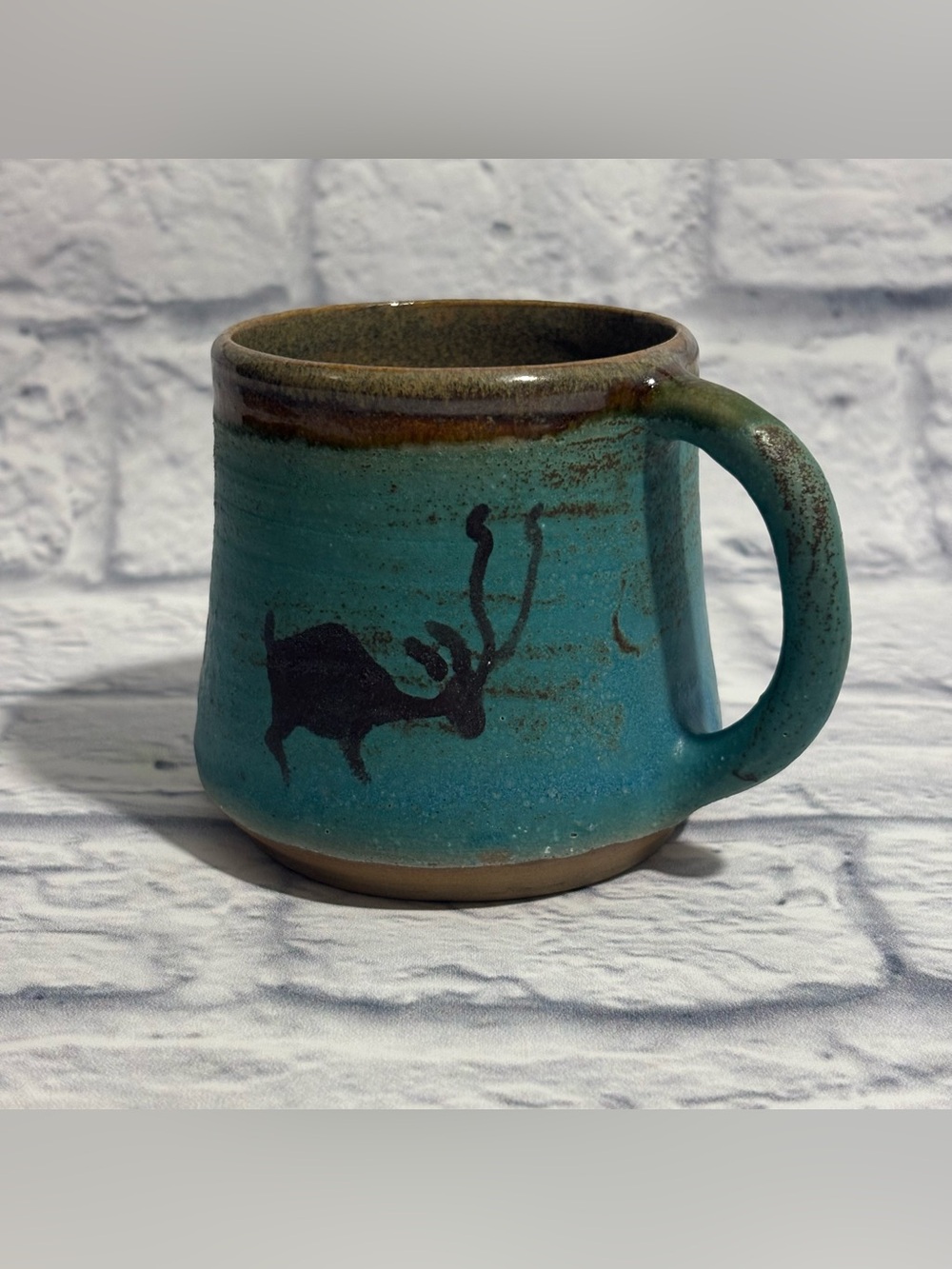 Handmade ceramic antelope silhouette turquoise glazed mug